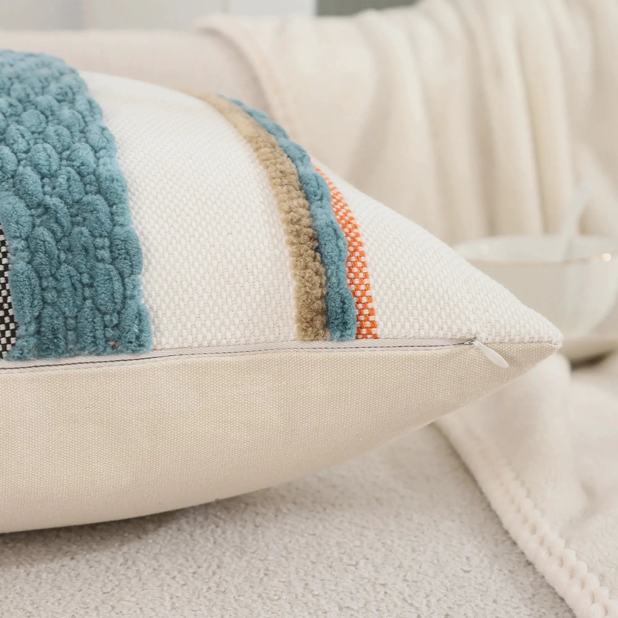 Simples Market 18x18 Boho pillow cover; beige woven fabric with teal chenille edge and orange striped piping