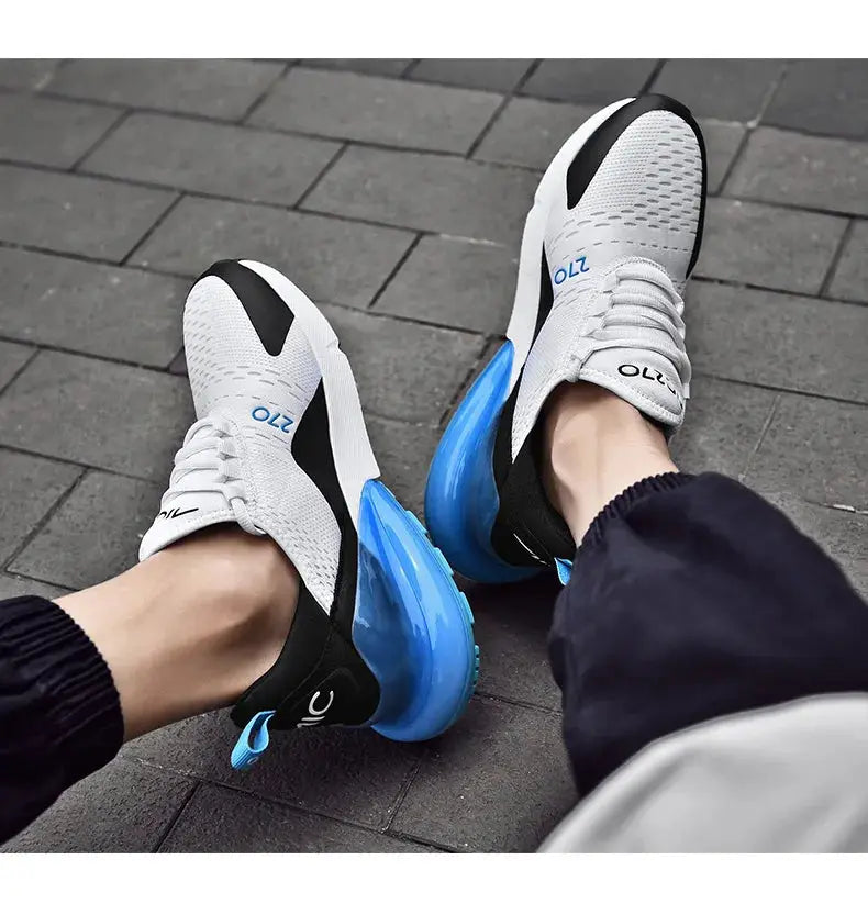 OLZ men's outdoor jogger sneakers with white breathable mesh upper, black overlays and blue air-cushioned sole.