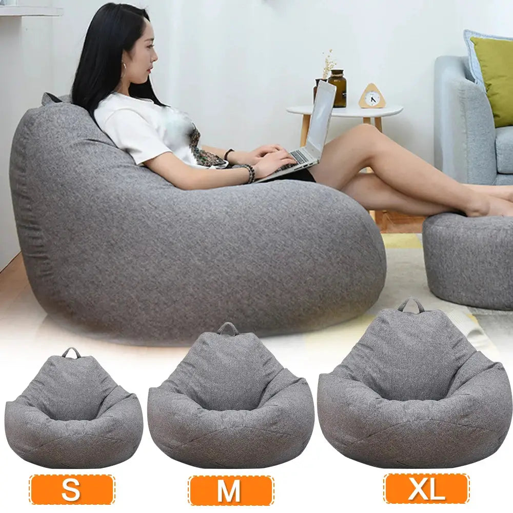 Bean bag lounger in gray linen fabric with no filler, shown in S, M, XL sizes