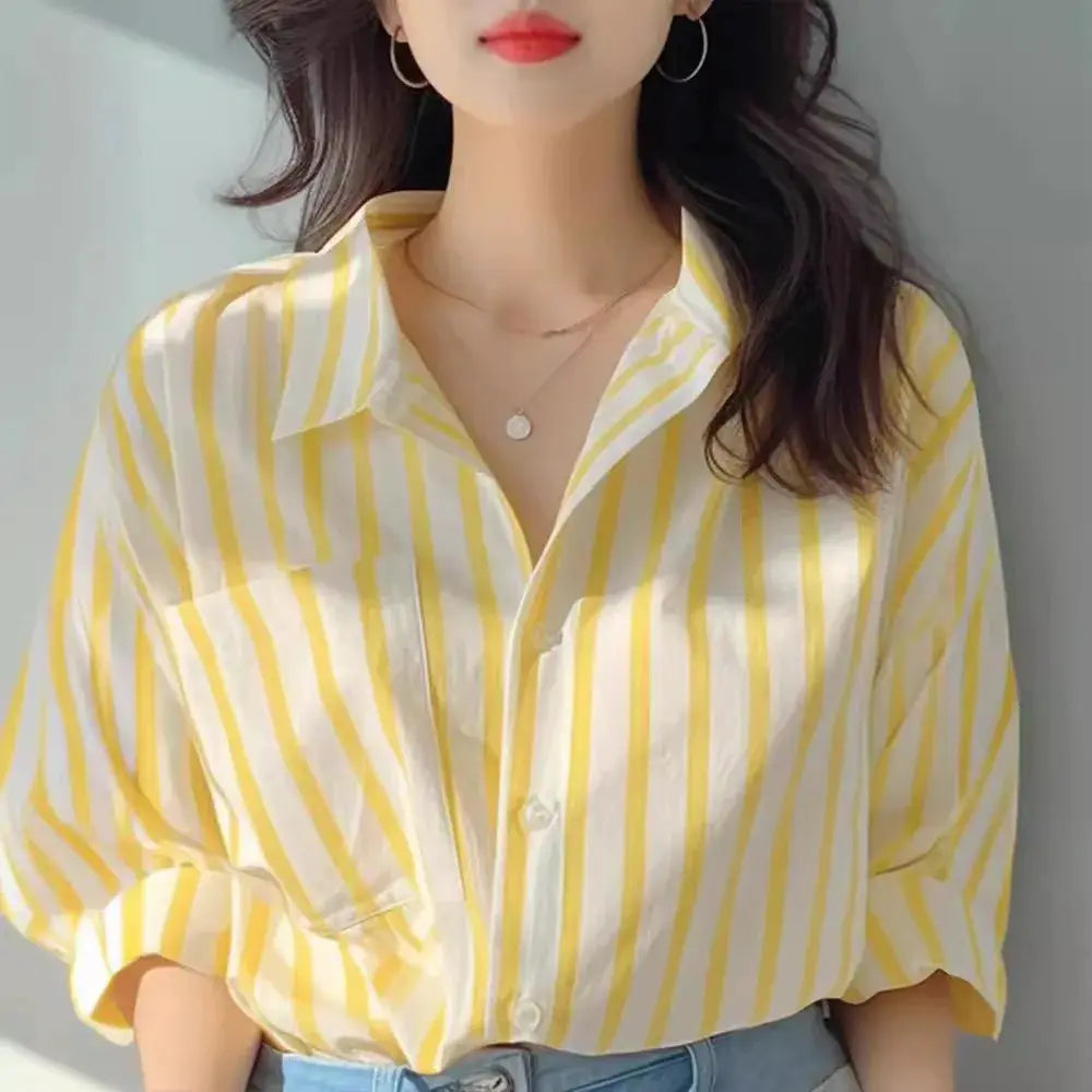 Yellow and white striped women's shirt, long sleeves, button-front, casual European style.