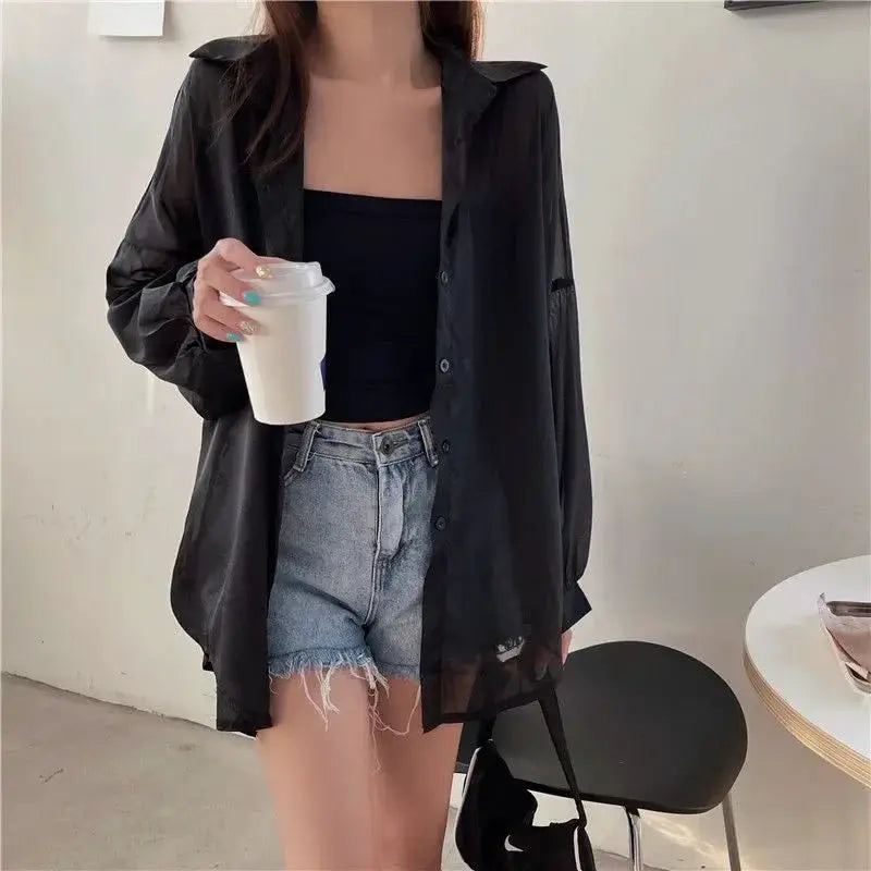 Xpqbb women's sheer black chiffon shirt, long-sleeve button-down blouse worn over a black tube top with denim shorts