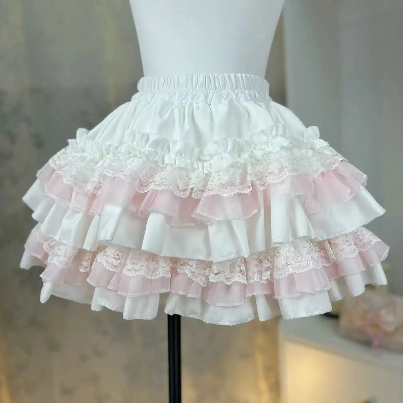 Lolita style cake skirt by Simples Market; white with pink lace-trimmed ruffle layers and tiered frills