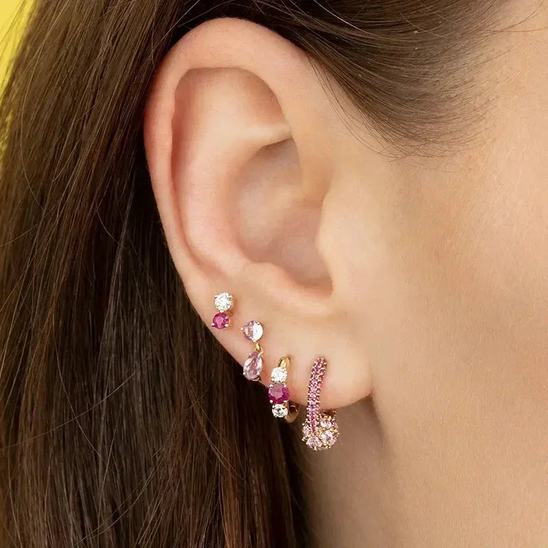Sterling silver pink zircon ear jewelry set featuring multiple studs and small hoop earrings