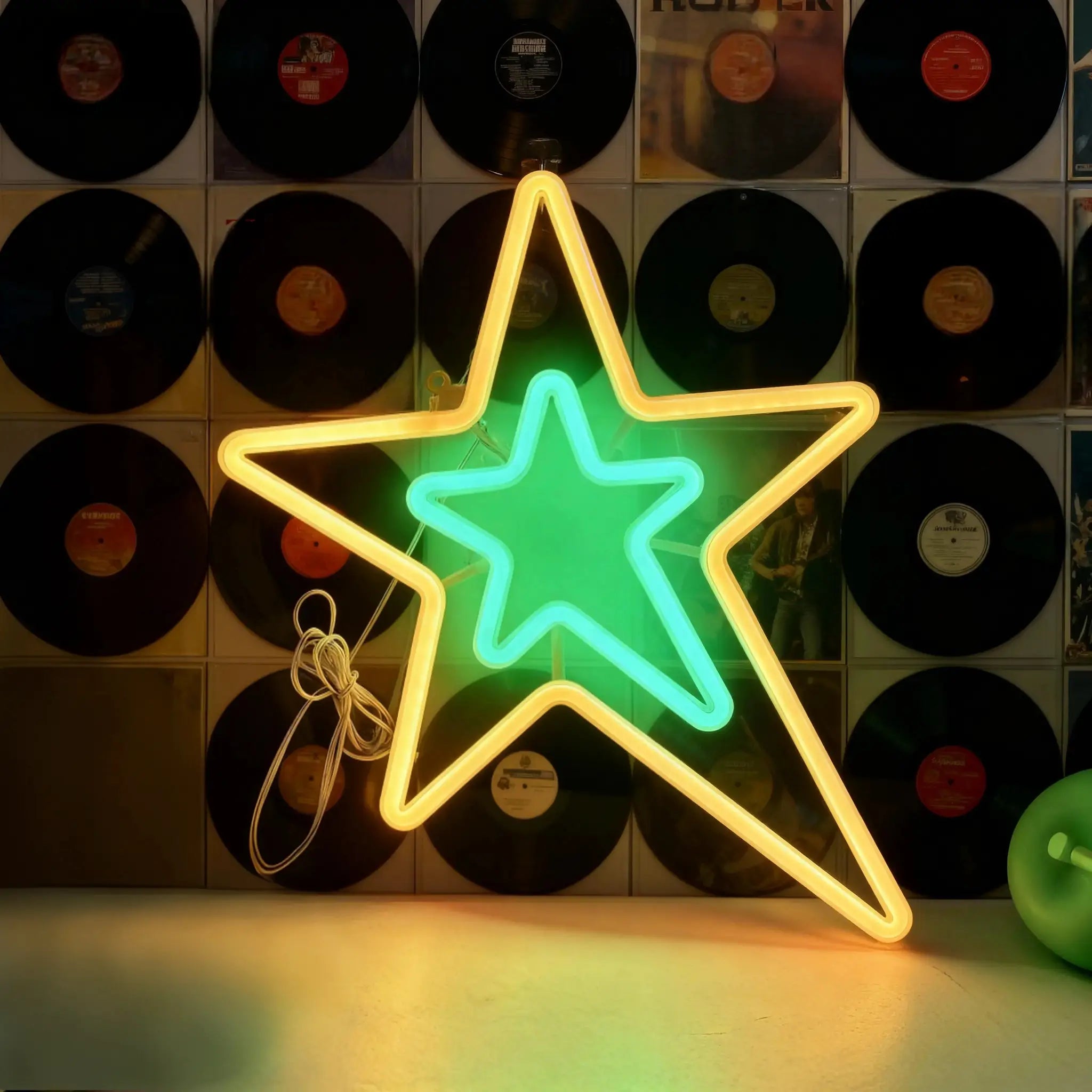 Decorative neon star light with yellow outline and green-blue interior; USB or battery powered wall decor