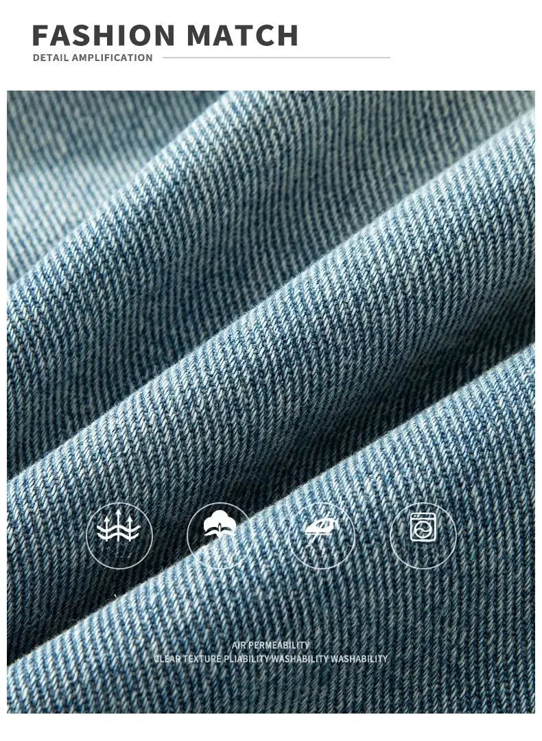 Denim shorts by Simples Market; blue vintage-wash denim fabric close-up