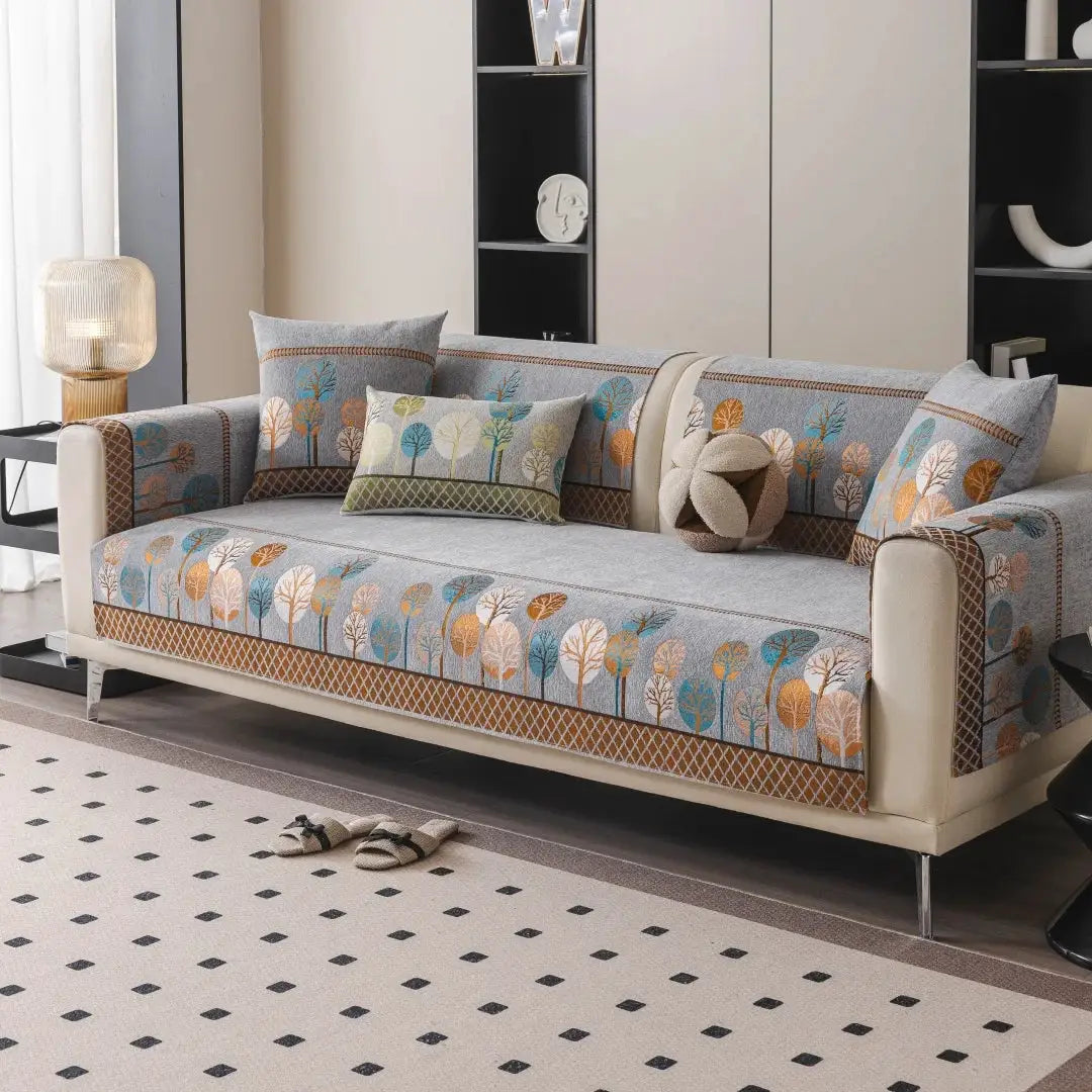 Simples Market Boho Full Moon Tree Jacquard Chenille sofa cover on beige couch with multicolor tree pattern