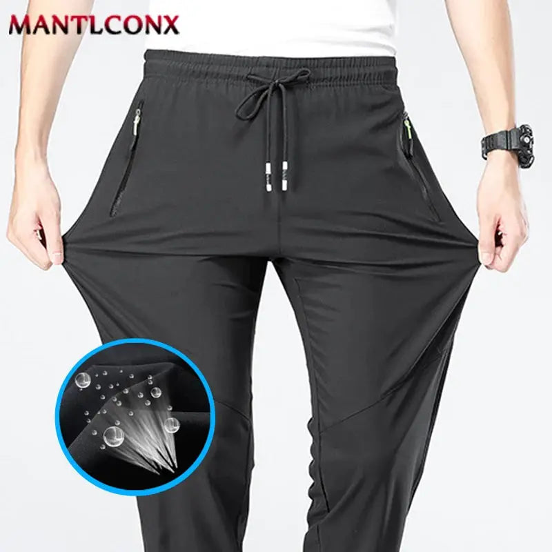 Men's black breathable quick-dry jogger pants by MANTLCONX, Simples Market with elastic waist and zip pockets