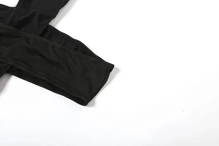 Jumpsuit fabric close-up in black showing seam and elastic edge detail
