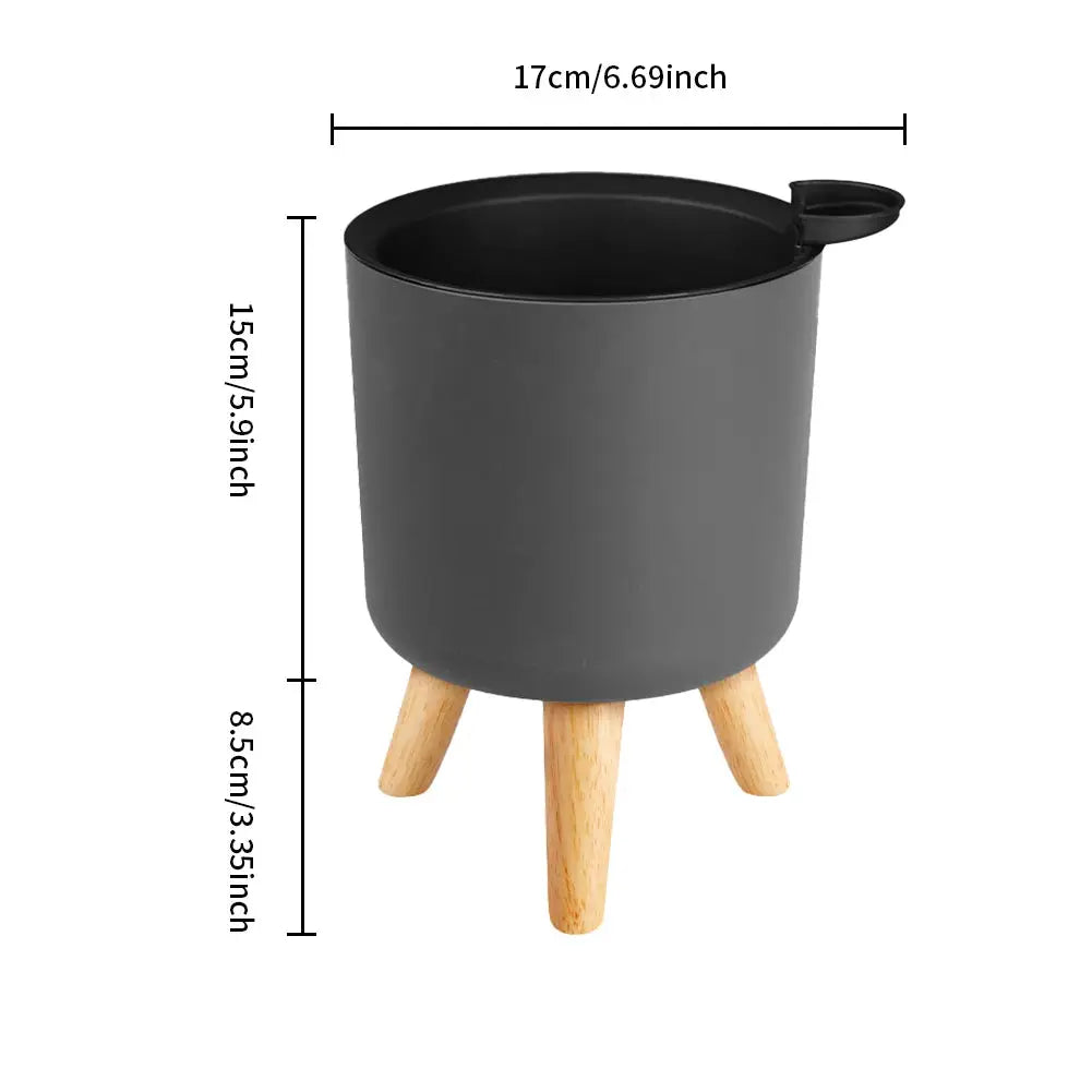 Floor-standing round gray plant pot on natural wood legs with self-watering drainage, Simples Market bonsai planter.