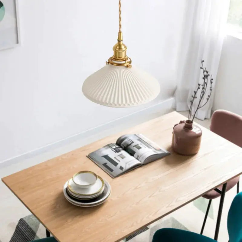 Simples Market pendant light with cream ceramic pleated shade and brass hardware
