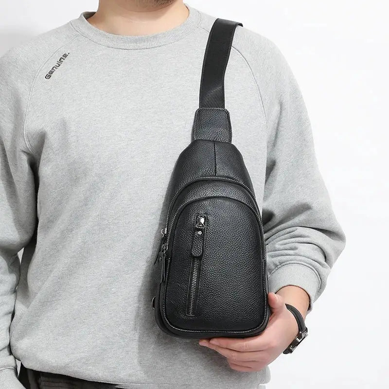 Black genuine leather men's chest bag with front zip pocket and crossbody strap