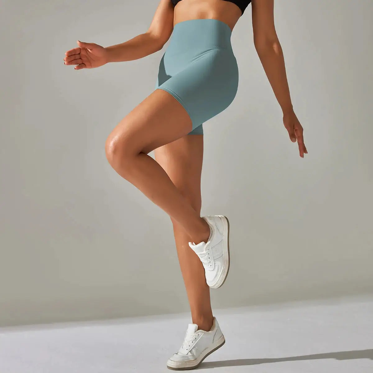 Women’s teal high-waist yoga shorts for workouts and gym