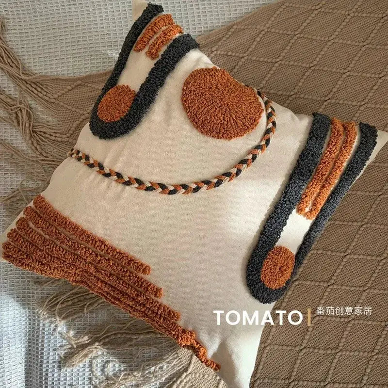 Bohemian long pillow cushion cover with geometric embroidery, orange tassels and dark gray trim for living room decor