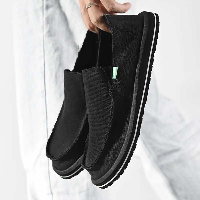 Simples Market pair of black canvas casual mens loafers, breathable low-top driving sneakers with white sole