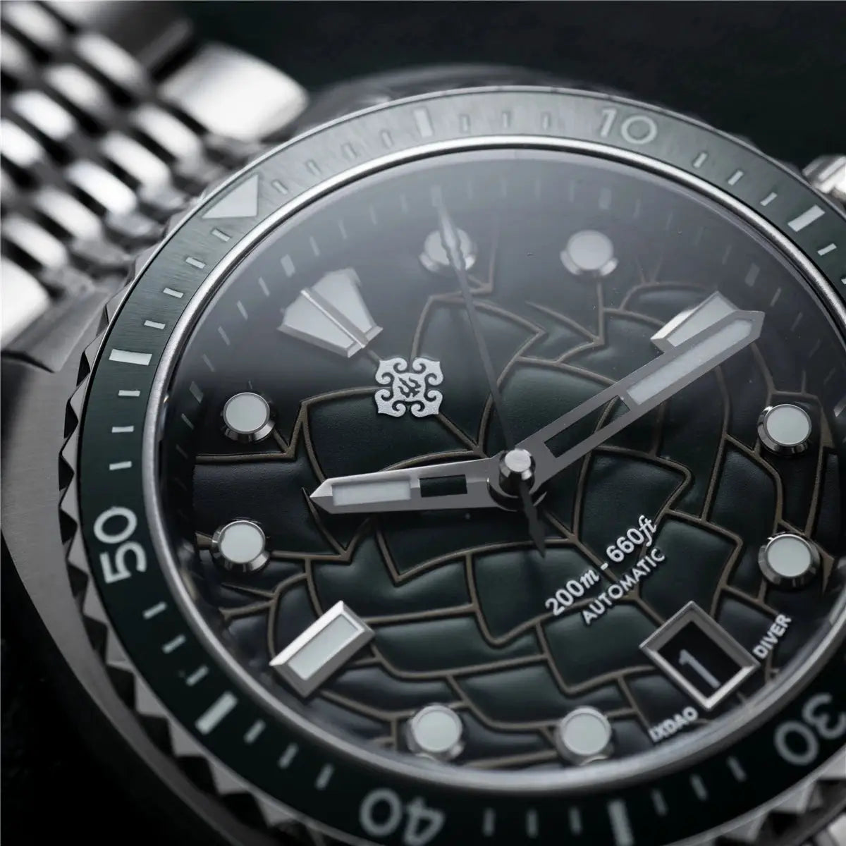 IXDAO IPOSE 2026 men's automatic diver watch with Poseidon pattern dial, green bezel, stainless steel bracelet