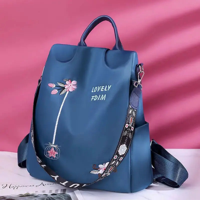 Waterproof Oxford Women Backpack by Simples Market with floral embroidery and adjustable patterned strap