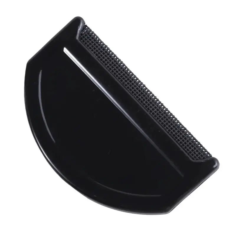 Black lint remover comb for sweaters with perforated blade