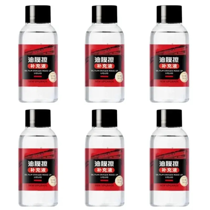 Six clear plastic bottles of car glass cleaner with black caps and red-black labels