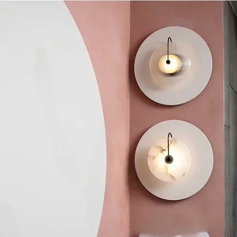 Nordic wall sconces with marble moon centers, LED glow, two white circular plates on pink wall