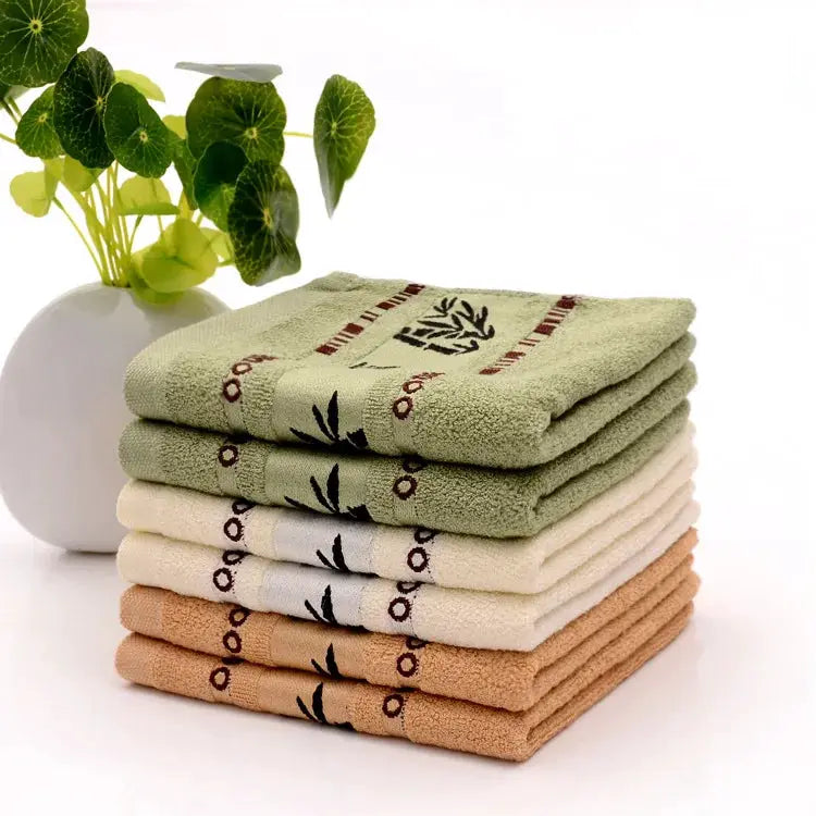 Bamboo fiber towel set, several towels in green, beige, white and brown, two sizes 34x74 cm and 70x140 cm