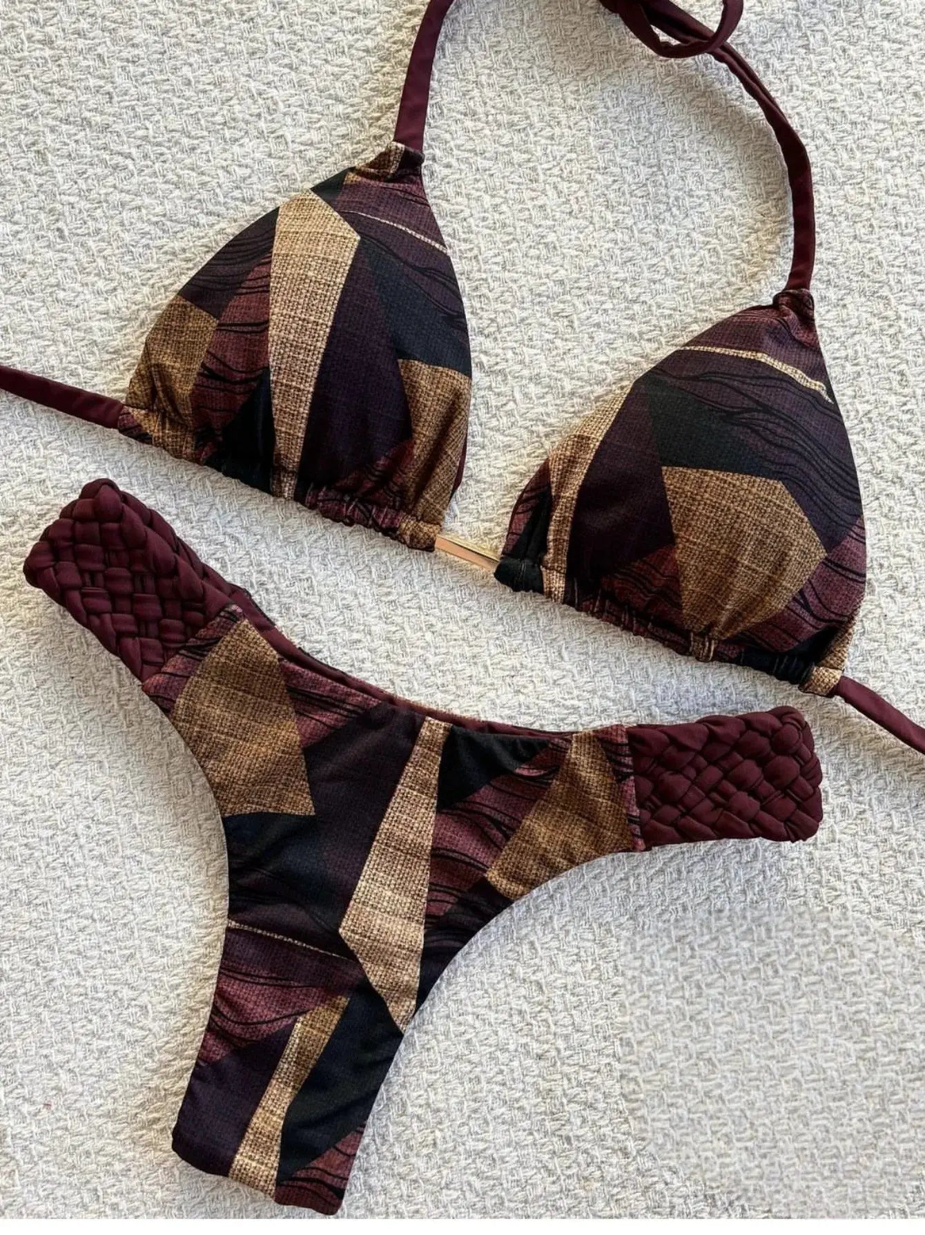RUOTONSEPT print halter bikini set by Simples Market; two-piece swimsuit in maroon, black and tan geometric pattern.