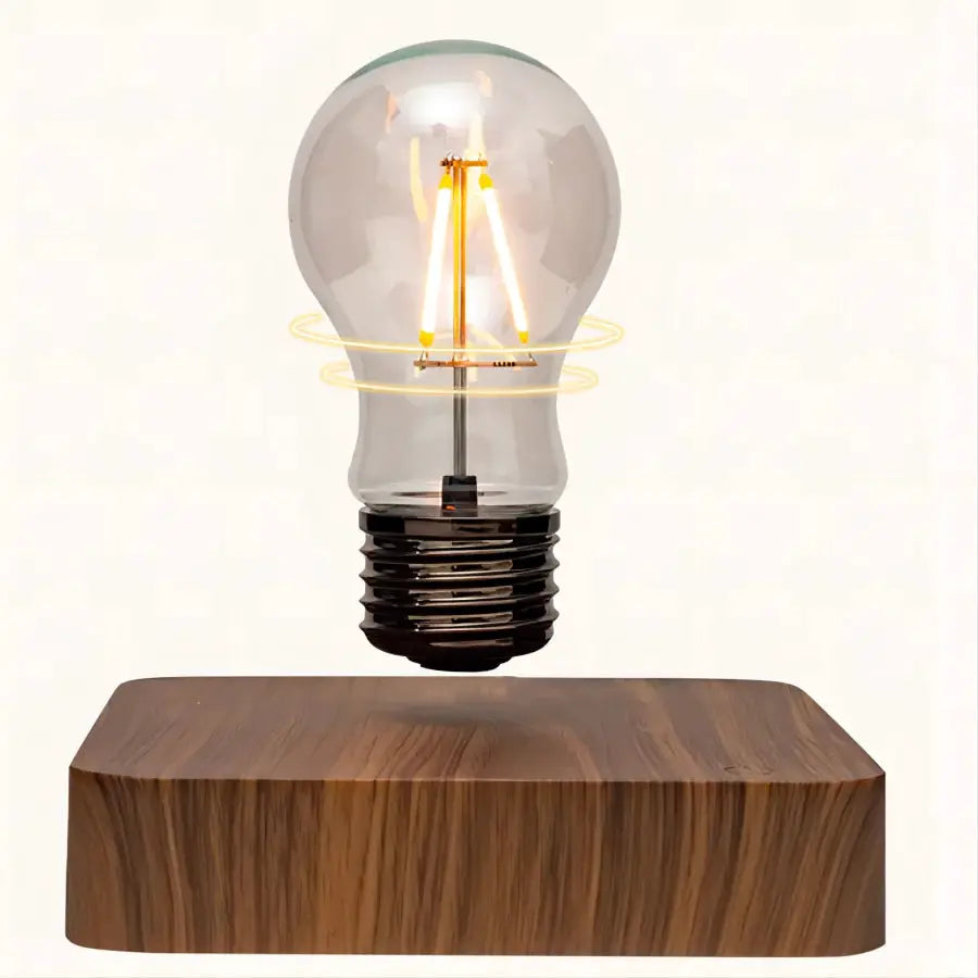 Magnetic levitation lamp with floating glass LED bulb above a wooden base for desk decor