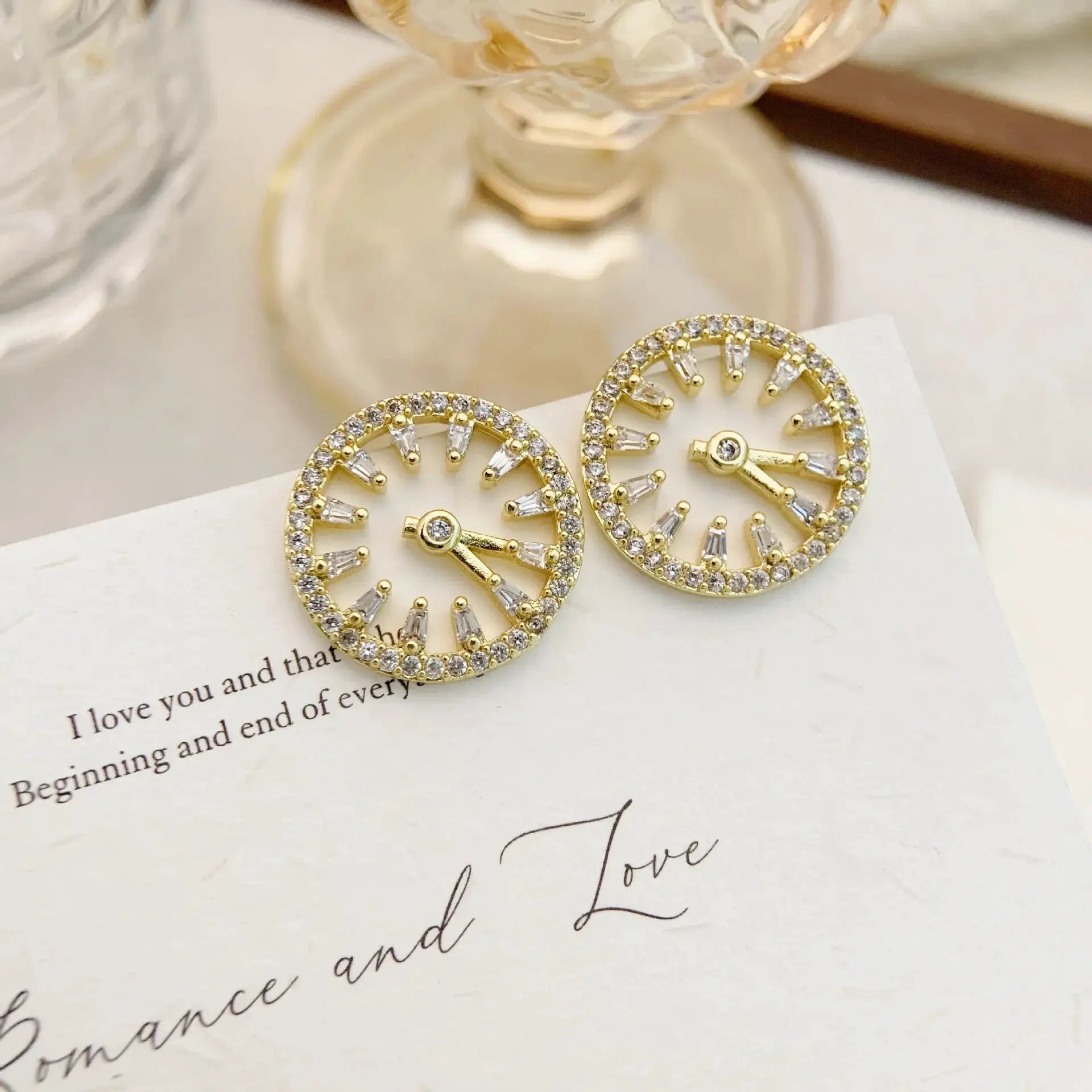 Pair of gold-tone clock-style earrings with crystal stones circular design vintage statement jewelry
