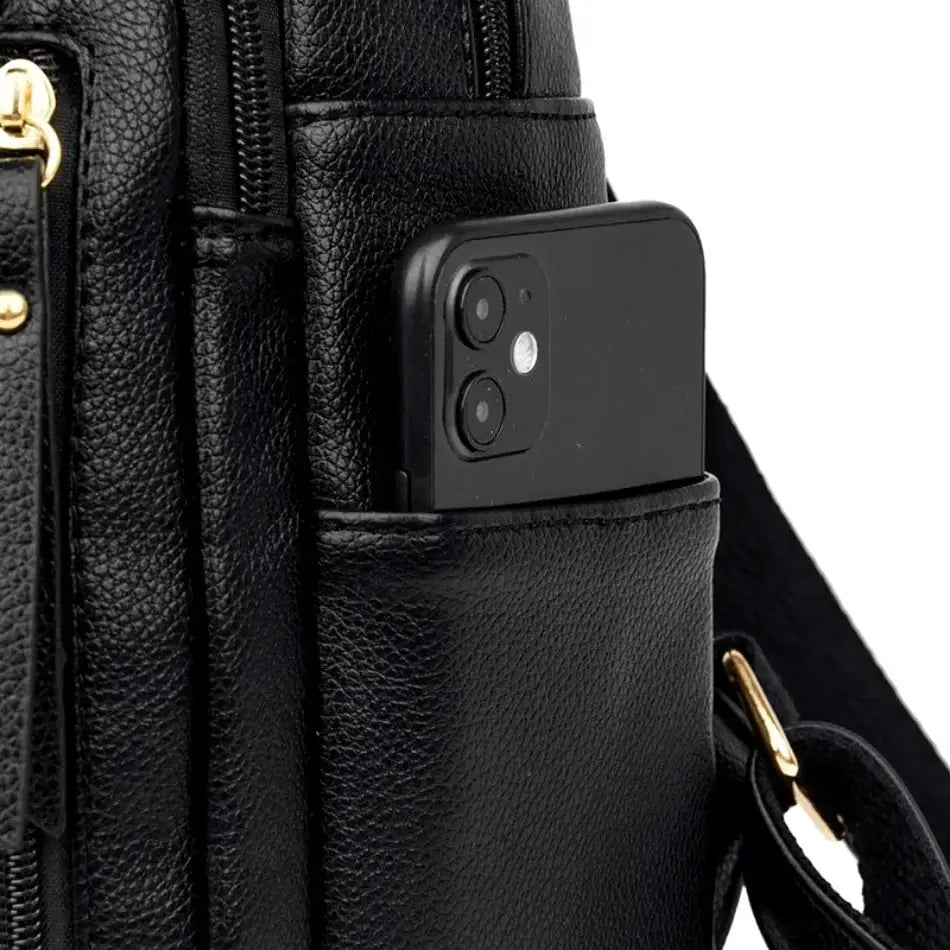 Women's black leather backpack with large capacity, side phone pocket and gold hardware