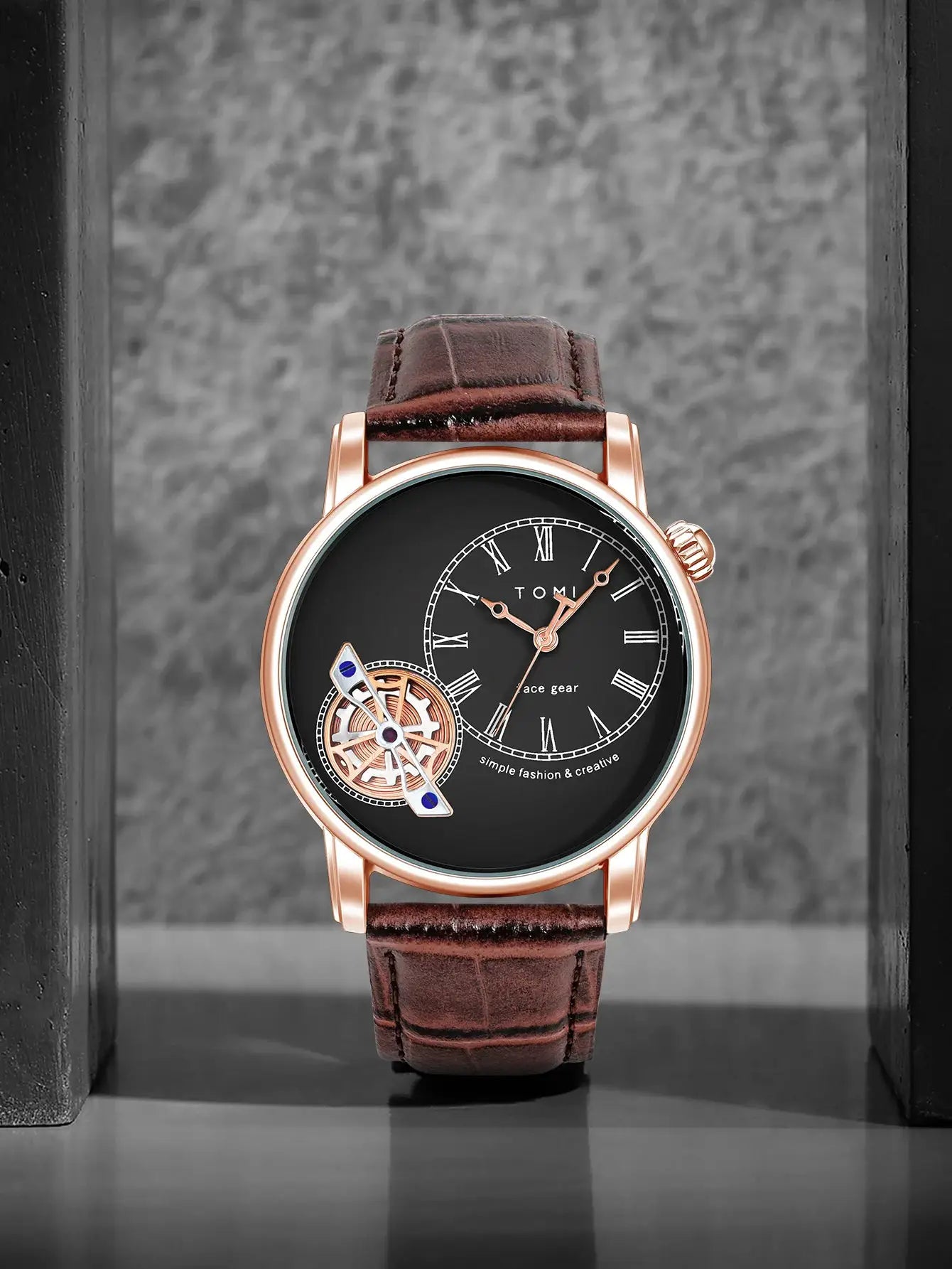 TOMI men's quartz watch with rose-gold case, black dial, brown leather strap and visible gear wheel.