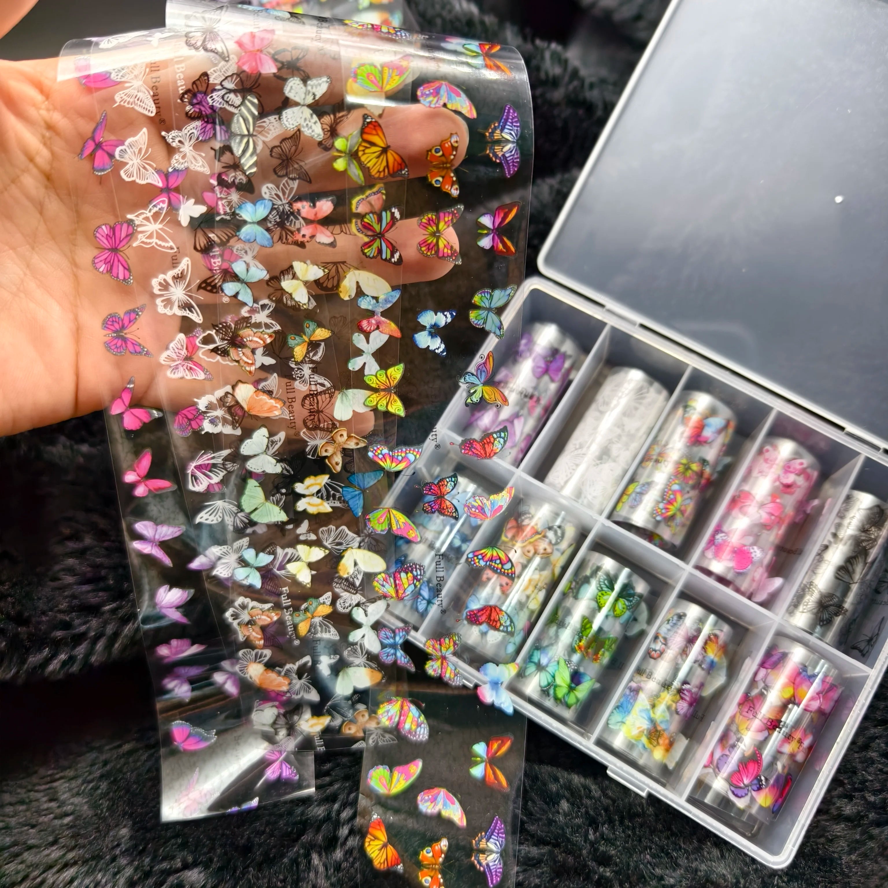 Butterfly nail foils on clear transfer sheets; colorful decals by Simples Market