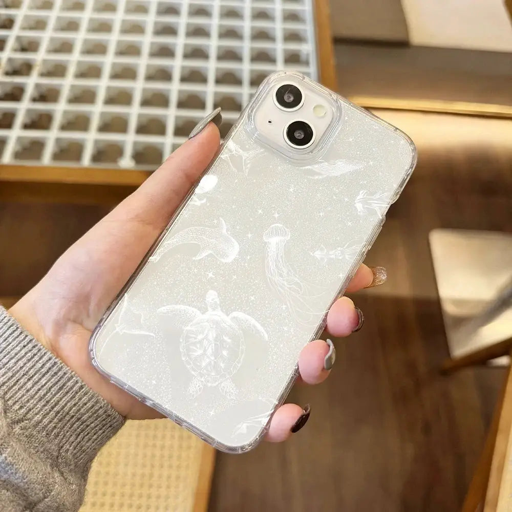 Phone case for iPhone, transparent glitter cover with white sea life pattern