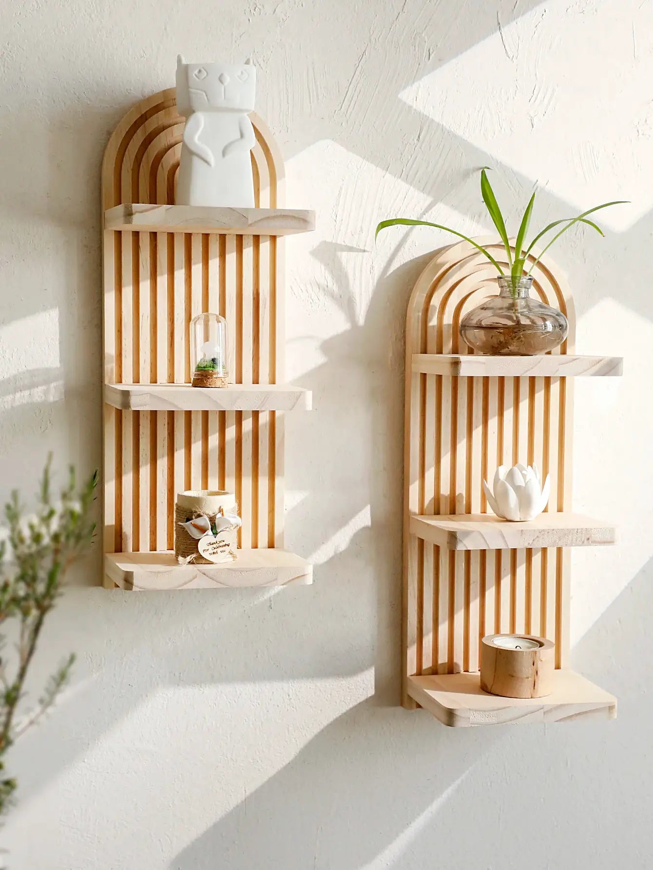 Two Boho style geometric wooden wall shelves in natural wood finish with vertical slats, plant decor by Simples Market