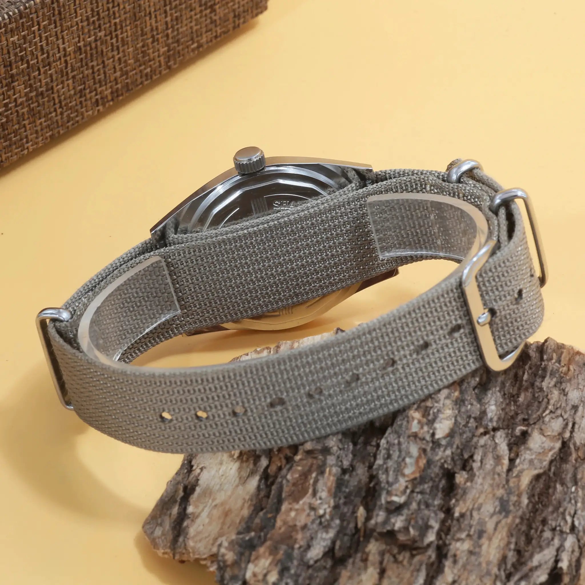 7120 hand-wind mechanical watch, 36mm, gray canvas strap, stainless steel case.