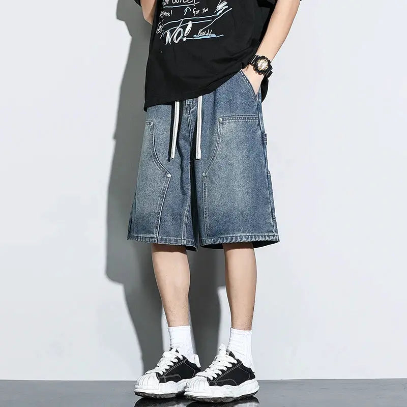 Men's blue denim cargo shorts with loose fit, knee-length and patch pockets