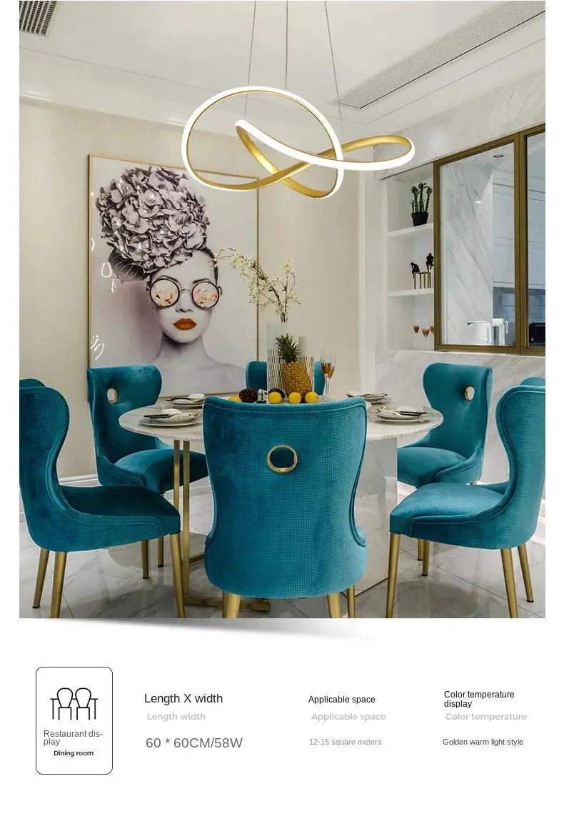 Dining room pendant lamp with gold and white intertwined rings over turquoise upholstered dining chairs