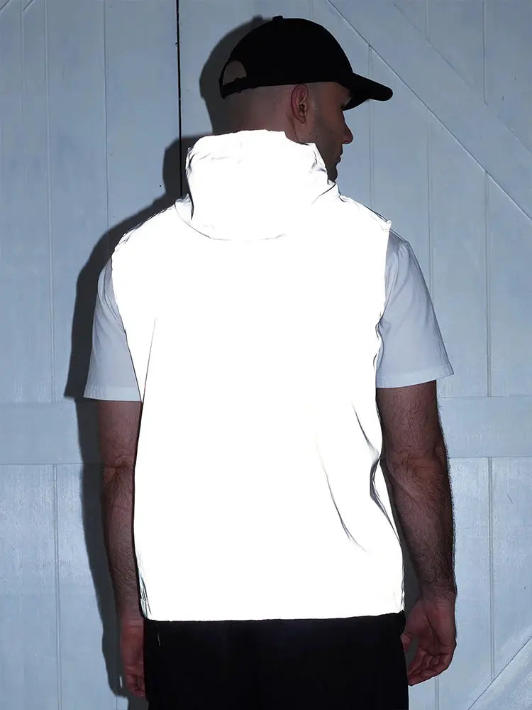 Night reflective hooded vest; white thin sleeveless jacket worn by man (back view).