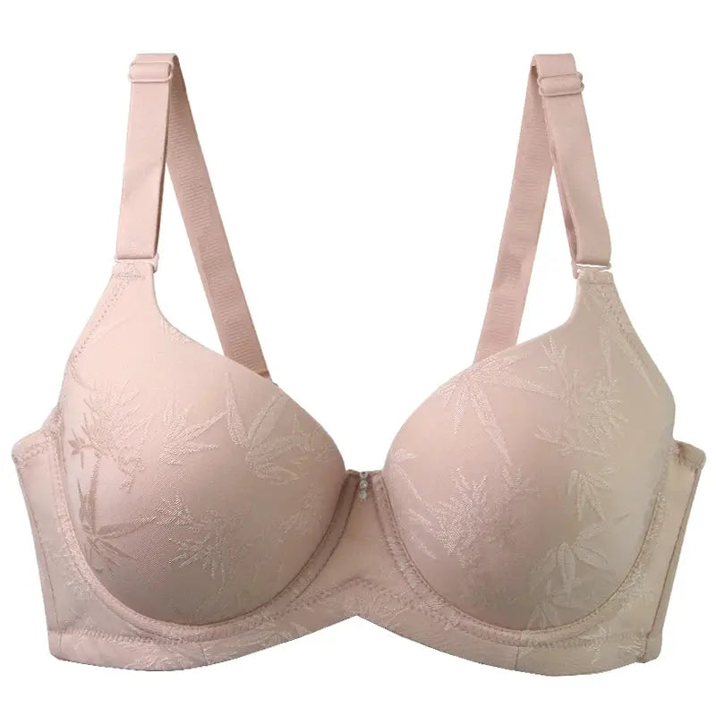 DaiNaFang pink push-up bra with floral embroidery and adjustable straps.