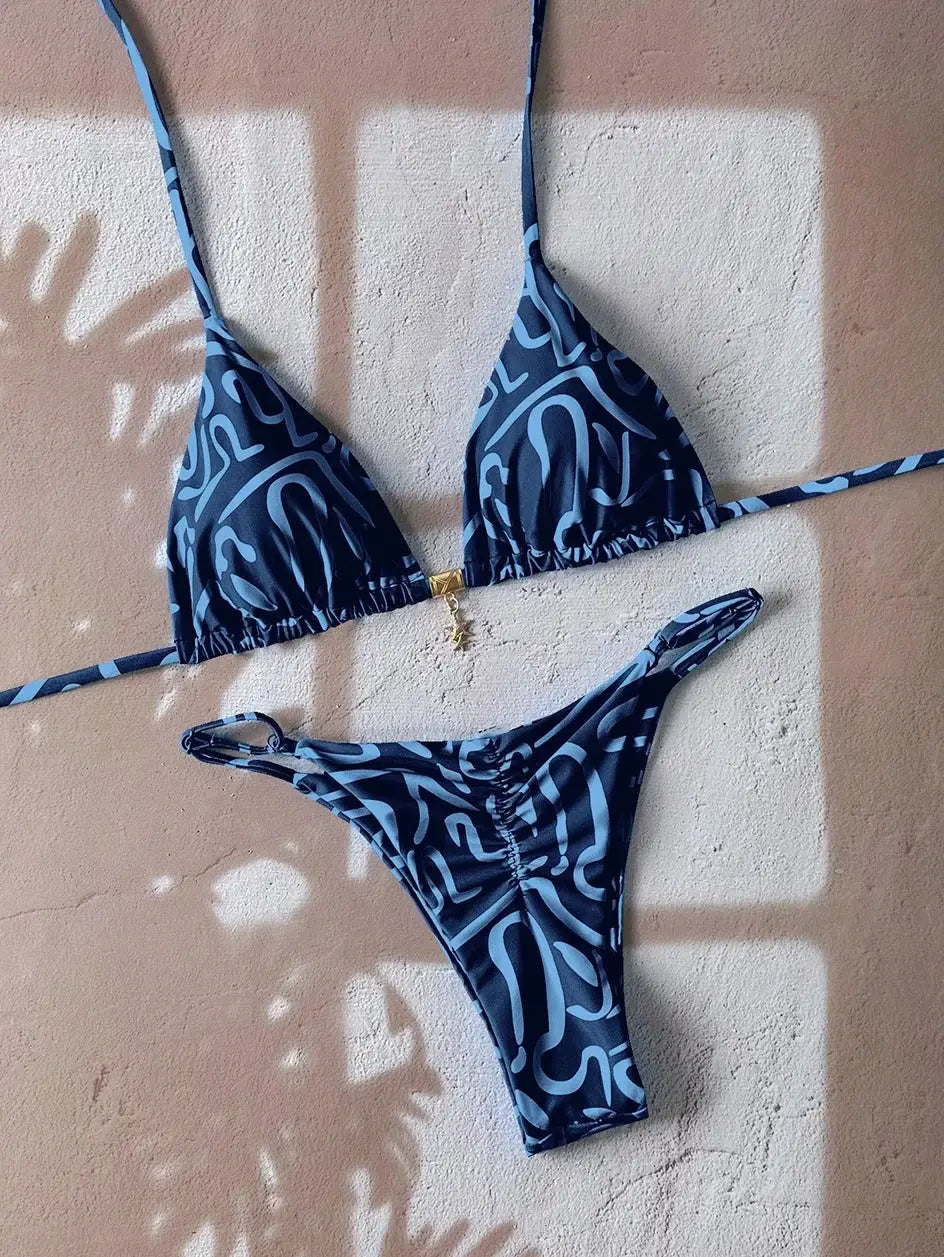 Two-piece leopard print push-up bikini set with triangle top and string thong bottoms in blue.