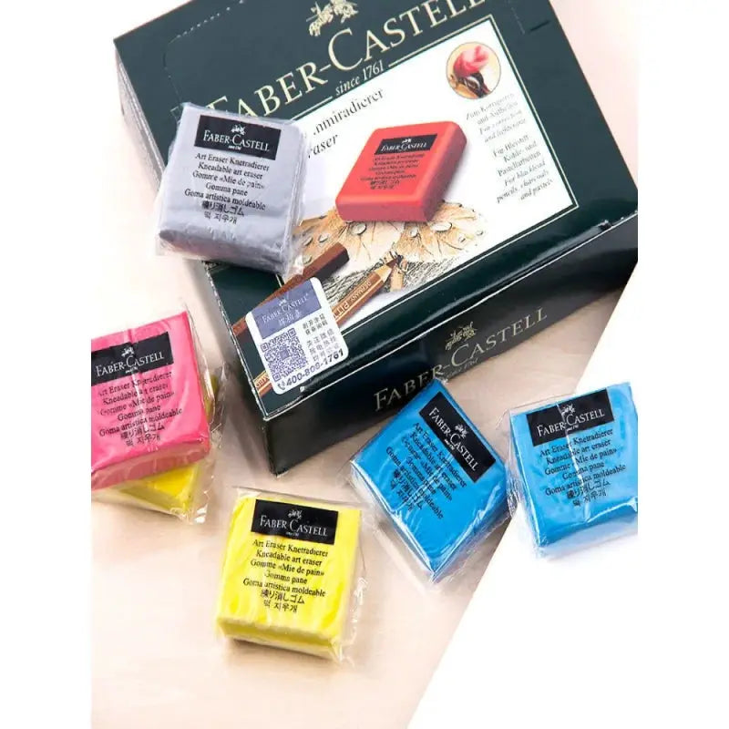 Six Faber-Castell kneaded erasers in assorted colors with a black Faber-Castell box