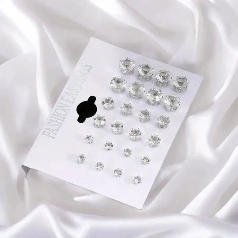12-pair six-claw zircon stud earrings set on a white display card with clear crystals
