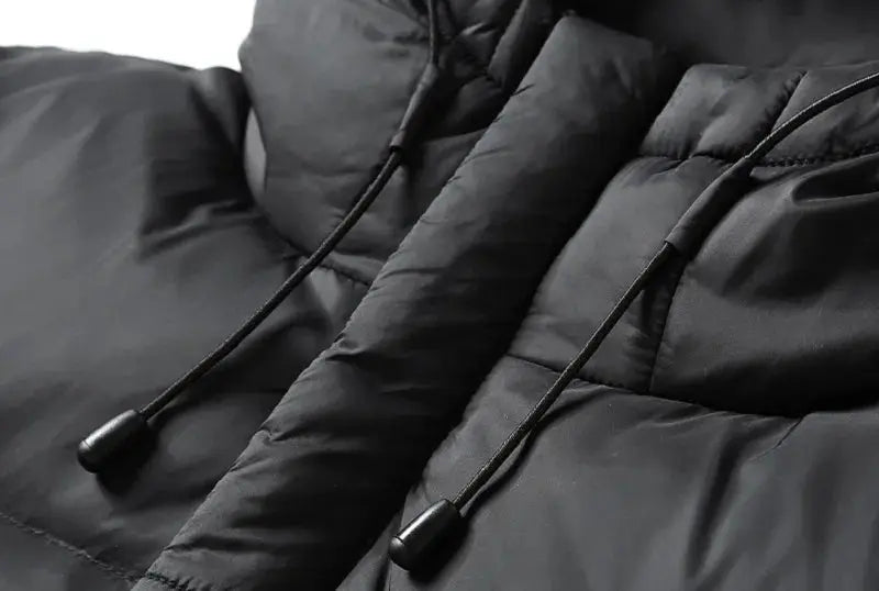 Men's black hooded down puffer jacket with quilted panels; water-resistant and warm