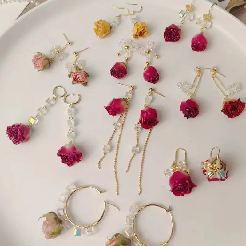 Red rose epoxy resin drop earrings by Simples Market