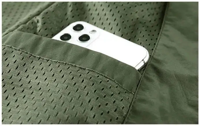 Men's green outdoor cargo vest, sleeveless with breathable mesh and phone pocket.