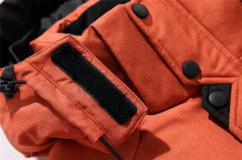 Men's orange duck-down jacket by Simples Market with hood and Velcro cuff.