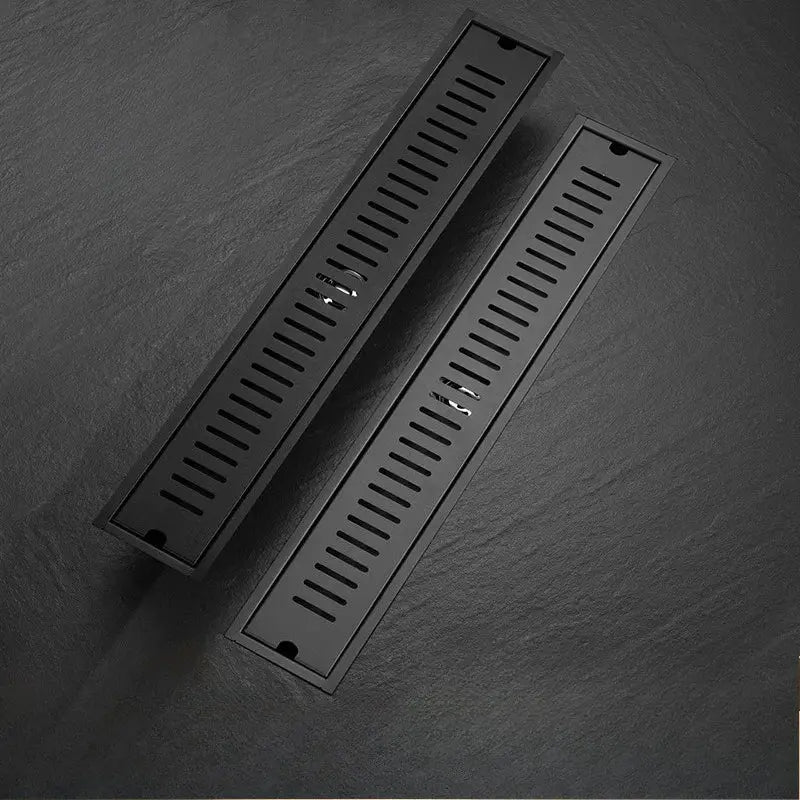 Pair of long rectangular floor drains in black stainless steel (304) with dual channels