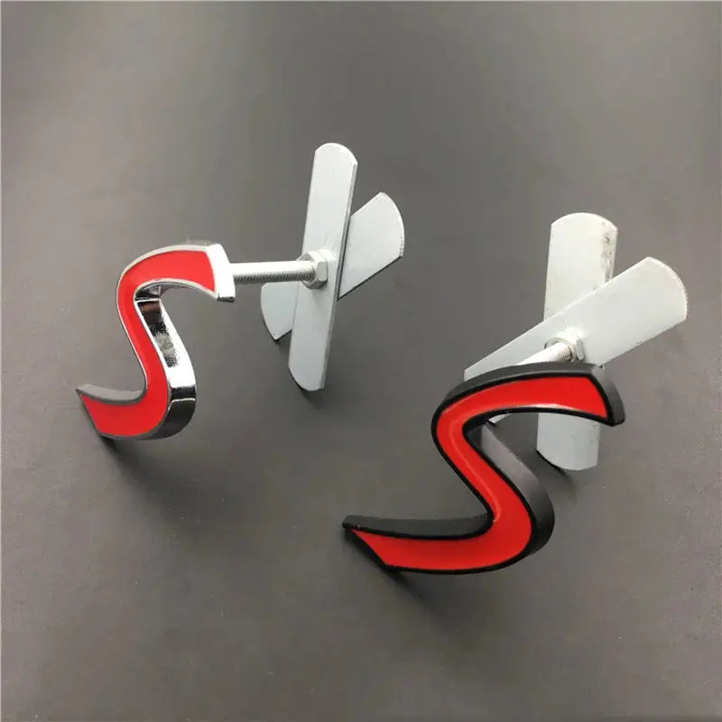 3D metal S car emblem badge pair with red inset and chrome edging for front grille
