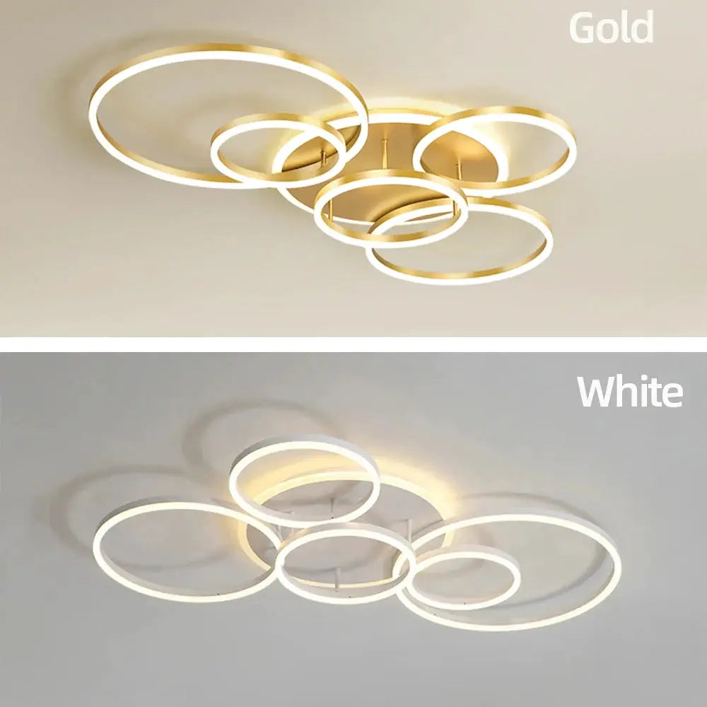 Modern LED ceiling chandelier by Simples Market, dimmable; interlocking circular rings in gold and white finishes.