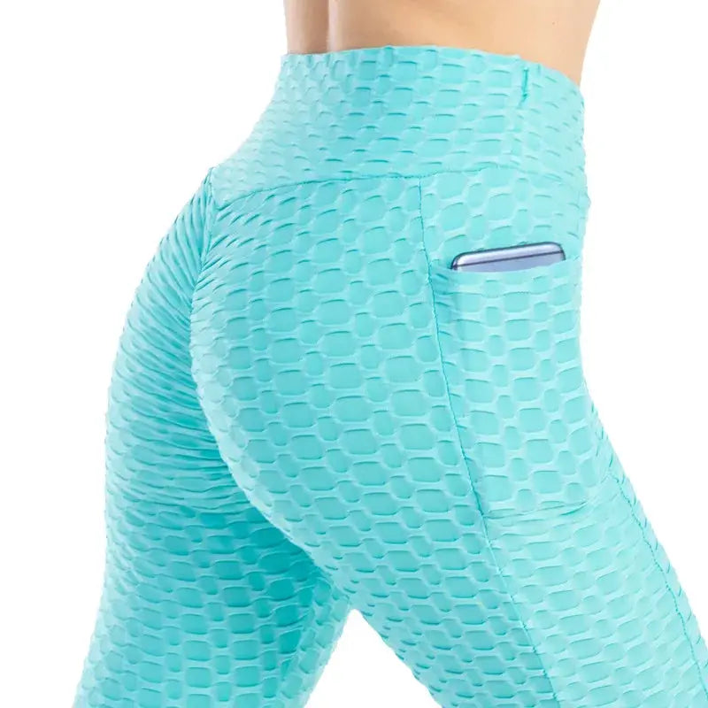 Pocket bubble leggings in turquoise, high-waisted, textured honeycomb fabric with side pocket from Simples Market