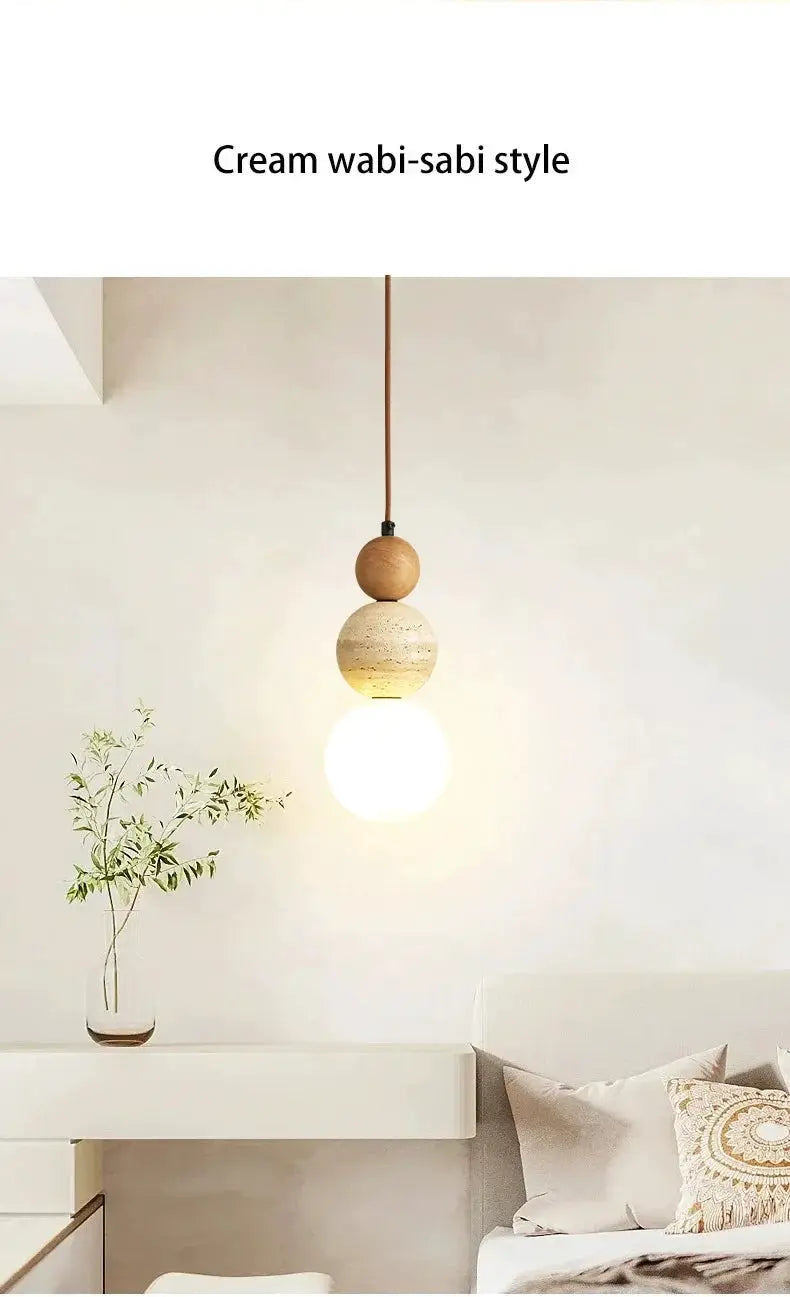 Cream style pendant lamp with stacked stone and wood beads and warm LED bulb