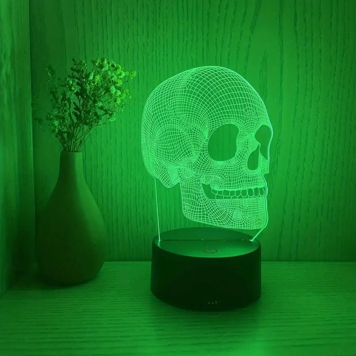 Skull-shaped USB night light by Simples Market, green LED wireframe skull on black base